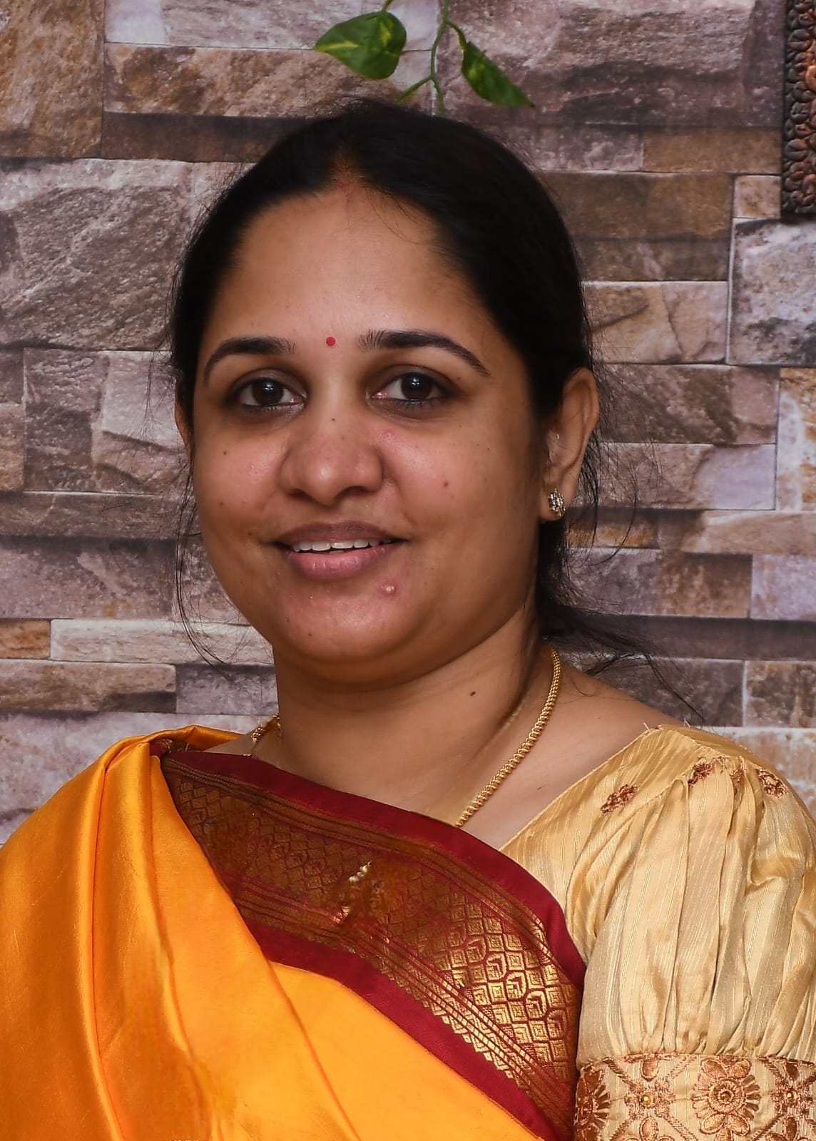 Dr. Gomati T